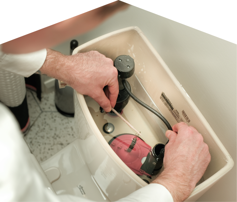 Mr. Furnace plumbing specialist adjusts internal components of a toilet tank, with tile flooring visible in the background. Mr. Furnace plumbing specialist adjusts internal components of a toilet tank, with tile flooring visible in the background.