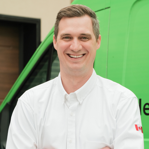 Mr. Furnace technician standing by our famous green trucks in a residential neighbourhood. Mr. Furnace technician standing by our famous green trucks in a residential neighbourhood.