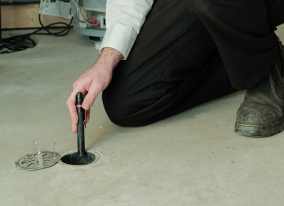 Mr. Furnace service personnel inserting a diagnostic tool into a floor drain for a residential drain and sewer service check. Mr. Furnace service personnel inserting a diagnostic tool into a floor drain for a residential drain and sewer service check.